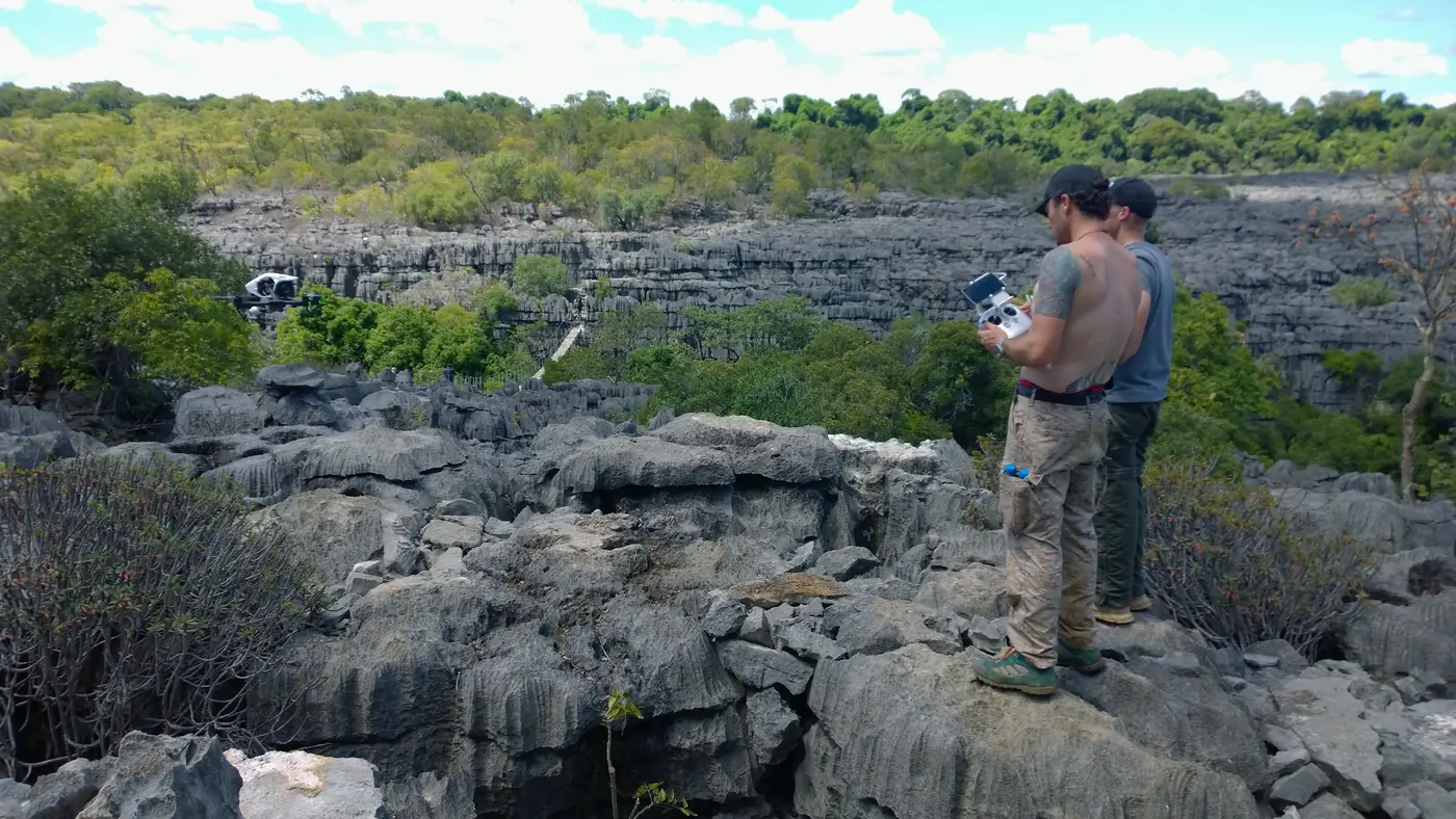Drone pilot filming over the limestone tsingy, Madagascar