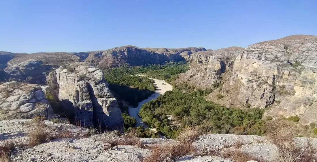 Sandstone canyon with a white sandy riverbed in Makay